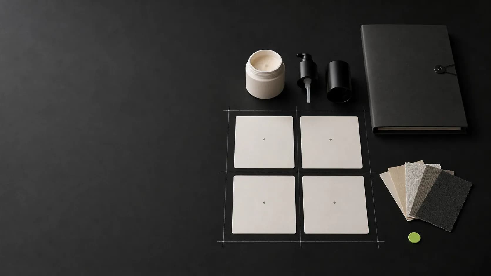 Four blank Project Fit cards beside an unbranded sample container, packaging components, a closed folder, and material swatches on a dark planning surface.